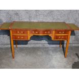 Traditional English Reprodux leather topped writing table fitted with t drawers by Bevan Funnell,