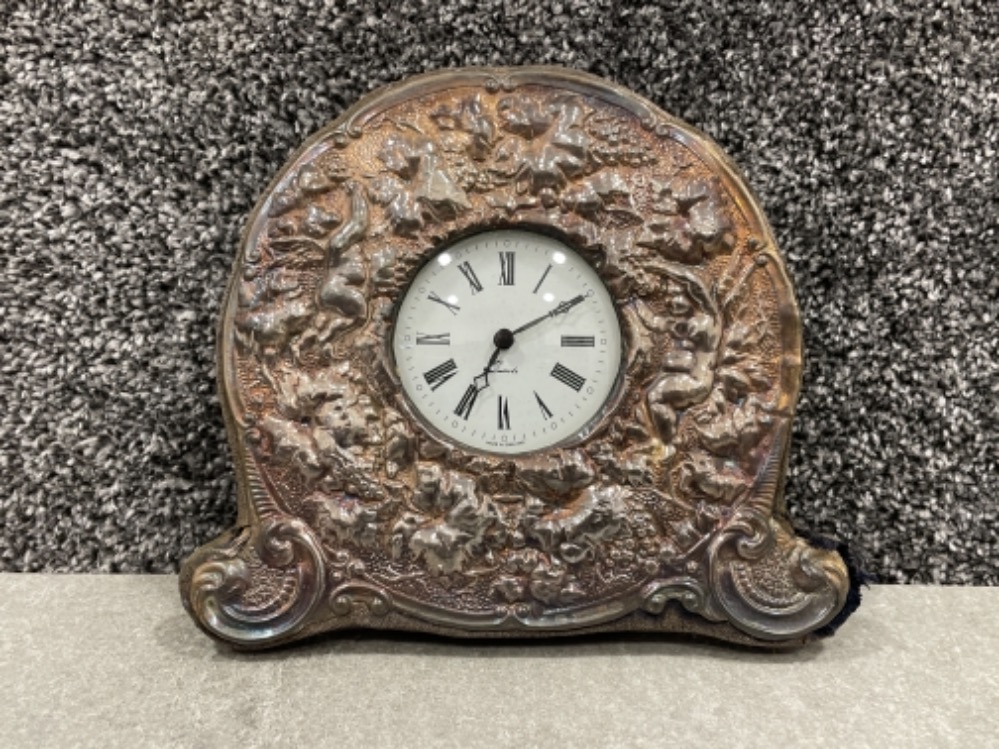 Hallmarked Silver cherub clock. Featuring a white dial and black Roman numeral hour markers