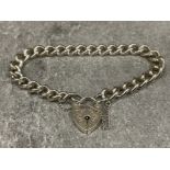 Ladies Silver charm bracelet with patterned padlock and safety chain