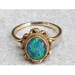 A 9ct yellow gold and opal triplet ring size P 3.1g gross.