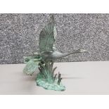 Patinated bronze figure group of 2 swans taking flight from marsh with indistinguishable signature
