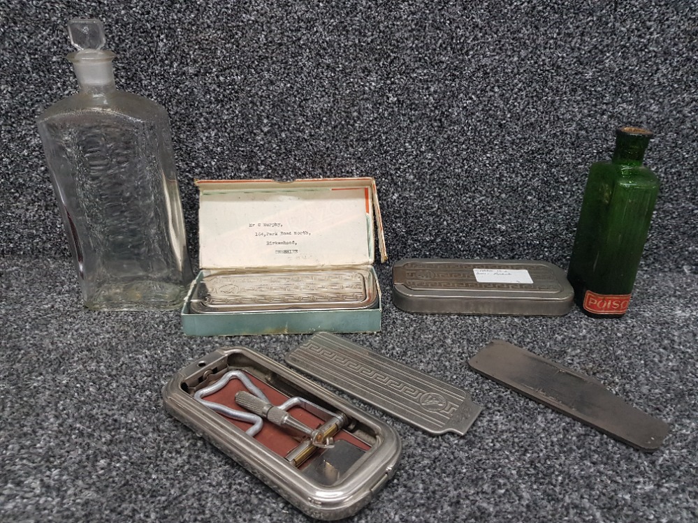 Three Rolls razors with small strop and two chemist's bottles one being poison.