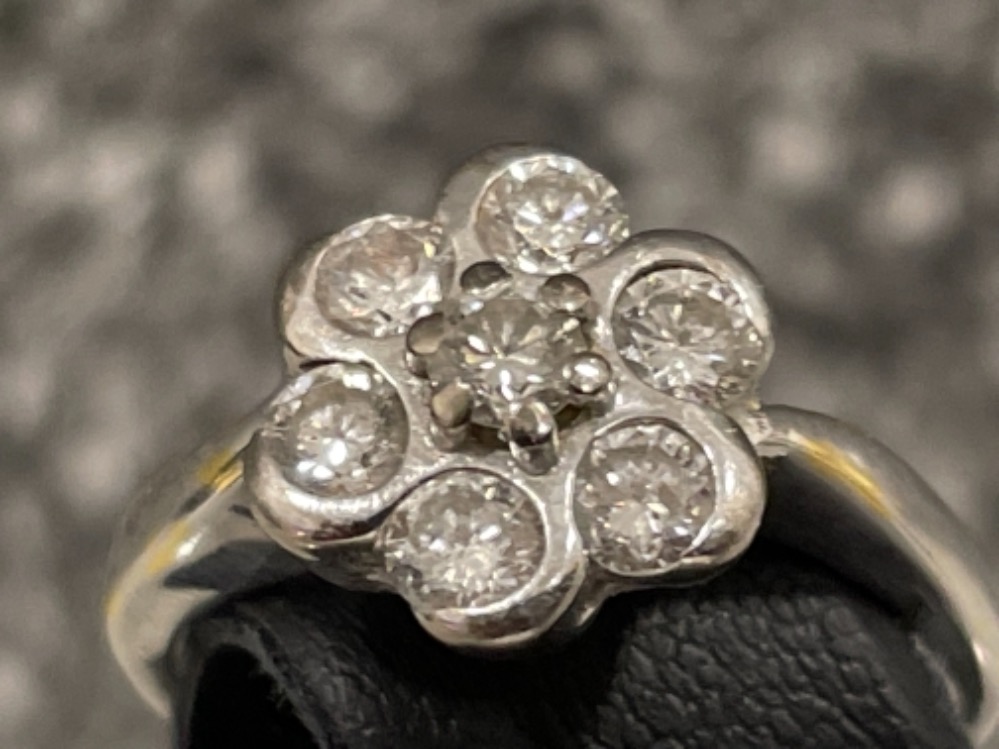 18ct white gold Diamond cluster ring. Comprising of 7 round brilliant cut diamonds, all set with rub