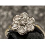 18ct white gold Diamond cluster ring. Comprising of 7 round brilliant cut diamonds, all set with rub