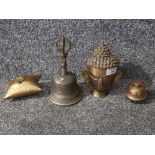 Brassware comprising two bells, budda head and a purse with purple velvet lining.