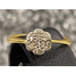 Ladies 18ct gold diamond cluster ring. Comprising of 7 round brilliant cut diamonds set in white