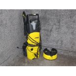 A Karcher K 3.80 pressure washer with attachment.