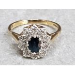 A 9ct yellow gold sapphire and diamond cluster ring size Q 1/2 3.3g.