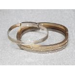 Adjustable sterling belt buckle type bangle together with three white metal unmarked snap bangles