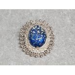 Silver and blue stone oval brooch 15.8g gross.