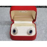 A pair of blue and white paste stud earrings in Ciro box