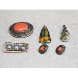 Five items of Scottish style costume jewellery comprising three brooches, pendant, and a pair of
