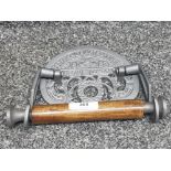 A reproduction cast iron st pancras toilet roll holder.