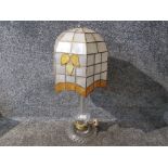 A tall hand cut glass table lamp with handmade shade.