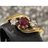 Ladies 9ct gold Red stone and Diamond Ring. Featuring red stone and round brilliant cut diamond