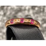 Ladies Rose gold ruby 3 stone ring.