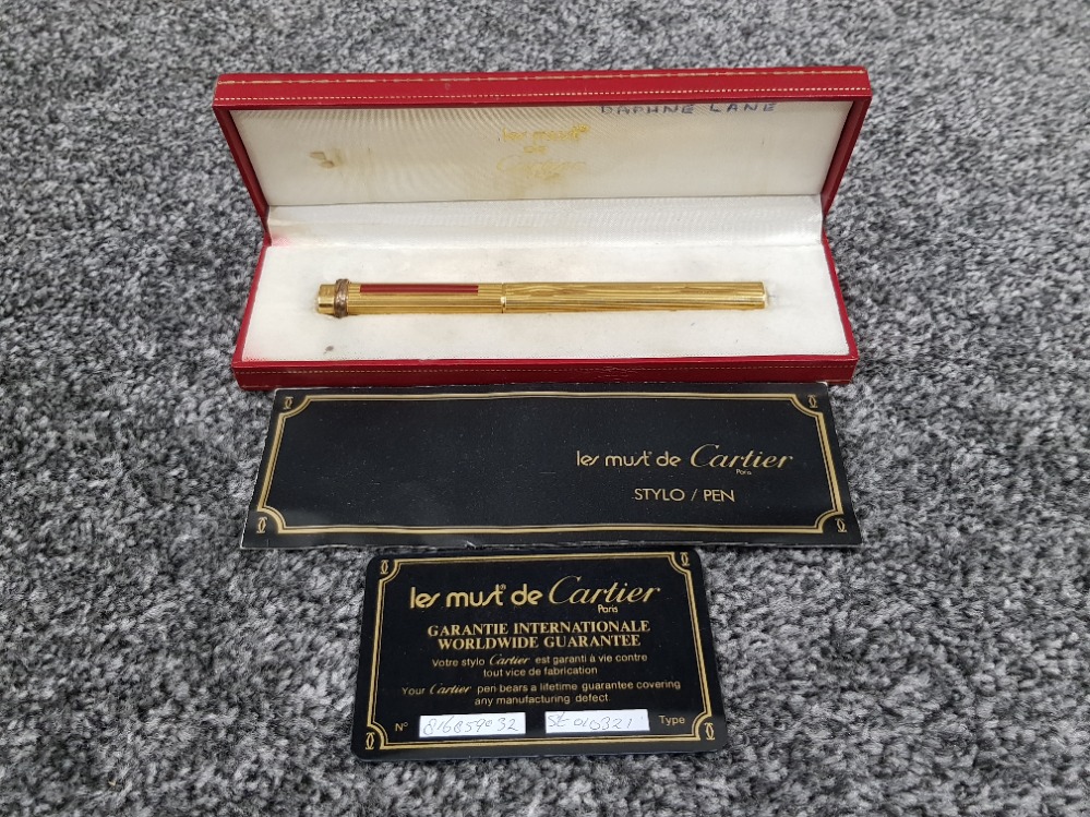 Cartier pen le must de Cartier ballpoint pen with red strips on the front in original box with