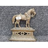 Vintage / antique brass door stop in the form of a saddled horse