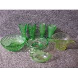 Eight pieces of local green pressed glass.