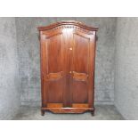 A Chinese hardwood wardrobe opening to reveal hanging space and shelf 121 x 203 x 59cm