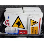 Box containing a variety of different notice & danger signs, well over 100
