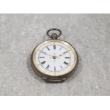 Ladies silver half hunter pocket watch with white dial black Roman numeral hour markers and floral