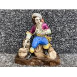 Staffordshire figure of seated pirate