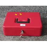 A red metal petty cash box with key.