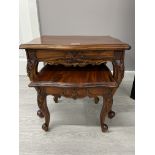 Heavily carved mahogany nest of 2 tables one is damaged to the top corner of the table