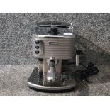 A Delonghi Scultura traditional barista pump espresso machine.