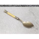 Ornate spoon with fancy handle and engraved pattern