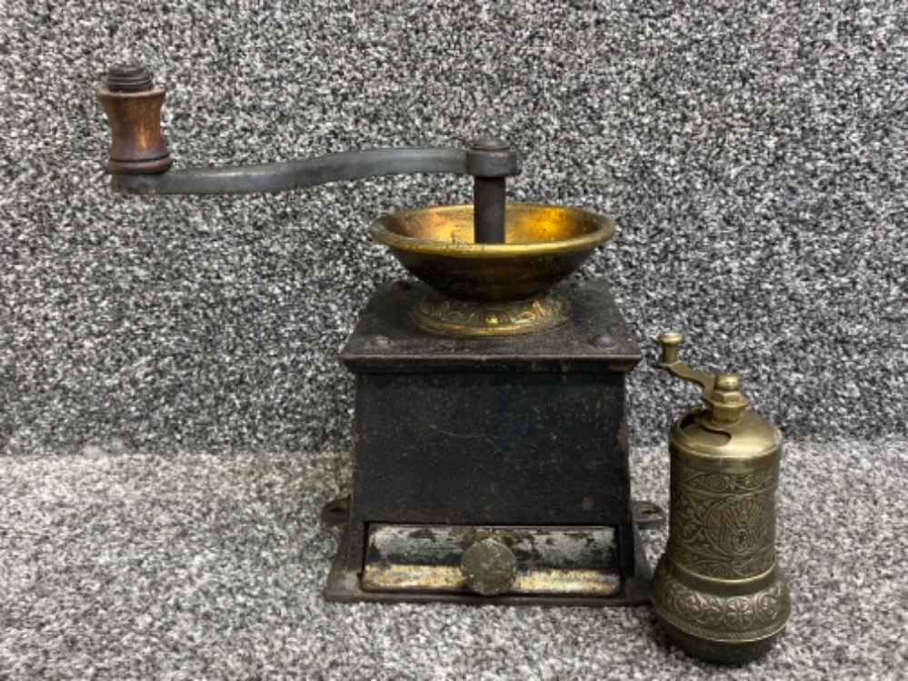 Cast Iron coffee grinder together with highly decorative Middle East pepper grinder
