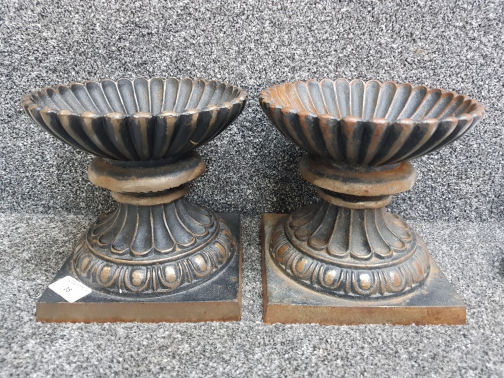 Pair of heavy cast iron urns, height 18.5cm