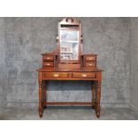 A reproduction mahogany dressing table with bevelled mirror 109 x 177 x 46.5cm