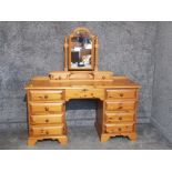 A pine dressing table/desk with associated mirror 142.5 x 148 x 47cm.