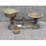 Set of kitchen scales with cast iron base , brass pans and weights