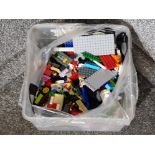 A quantity of Lego blocks and figures.