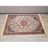 A Persian wool rug with floral motifs on cream ground 170 x 116cm