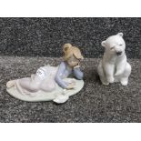 A Lladro girl with ducks 5609 and a Lladro polar bear.