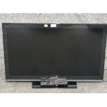 A Panasonic Viera 32" flatscreen TV with remote.