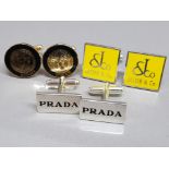 3 pairs of cufflinks in the style of Versace, Jacob & co and Prada