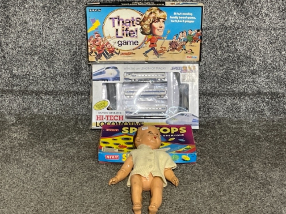 Vintage toy doll and also games including that’s life