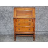 Oak bureau fitted with three drawers, plus key