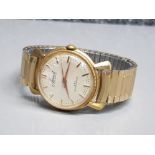 A gents Accurist gold coloured self winding wristwatch no 1478852.