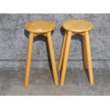 A pair of wooden breakfast bar stools.