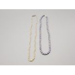 Lavender pearl necklace with 14k catch along with another pearl necklace with silver catch