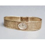 A ladies 9ct yellow gold bracelet wristwatch by Tissot 40.6g gross.