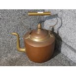 A Victorian copper and brass kettle.