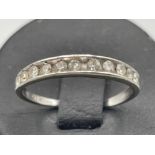 9ct white gold diamond half Eternity ring. Size K 1.38g