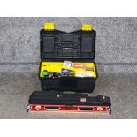 A toolbox with contents and a Forge Steel set of three spirit levels.